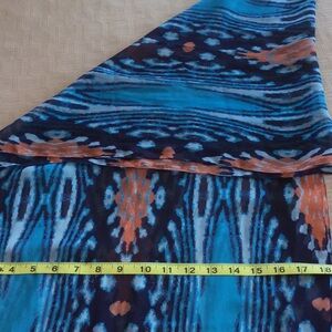 Women’s shades of blue with orange design scarf.